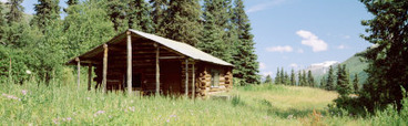 Log Cabin in a Field, Kenai Peninsula, Alaska, USA