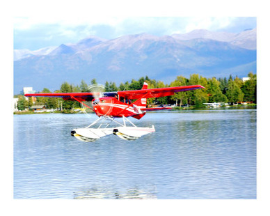 Red Floatplane landing in Anchorage Alaska