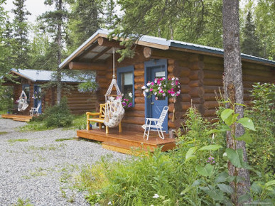 Log Cabins Nestled Among Trees Near Hatcher Pass, Palmer, Alaska, USA