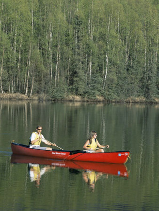 Man and Woman Canoeing in Mirror Lake, Chugach Mountains, Anchorage, Alaska, USA