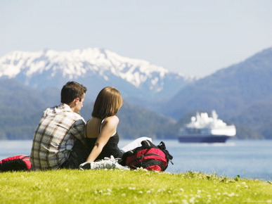 Couple Looking over Sitka Sound with Universe Explorer in Background, Sitka, Alaska