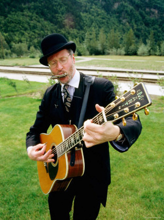 Man Playing a Guitar and Mouth Organ, Skagway, Alaska