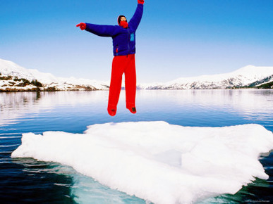Man in a Survival Suit Jumping on an Ice Floe, Blackstone Bay, Prince William Sound, Alaska